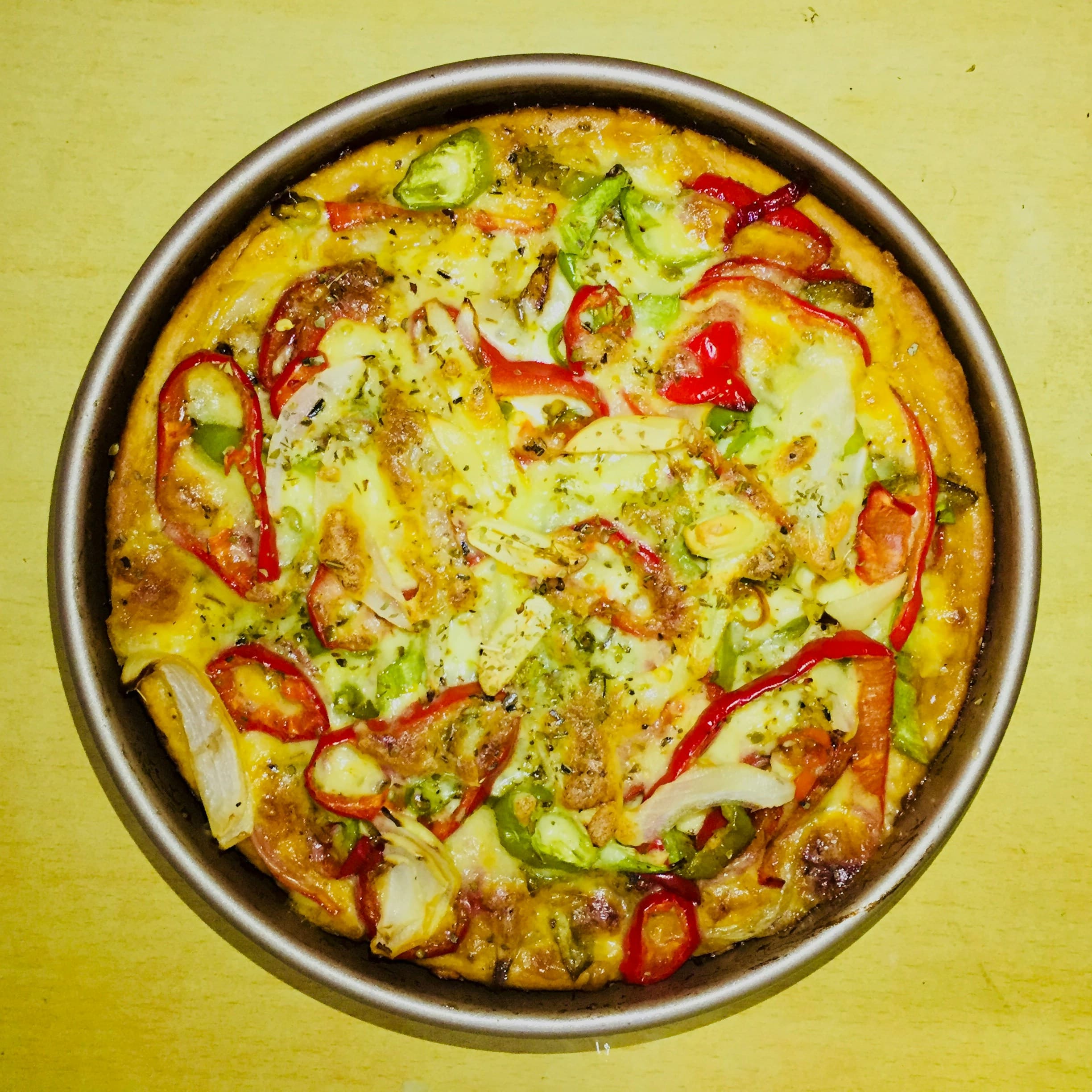 Capsicum pizza with colorful bell peppers and golden melted cheese