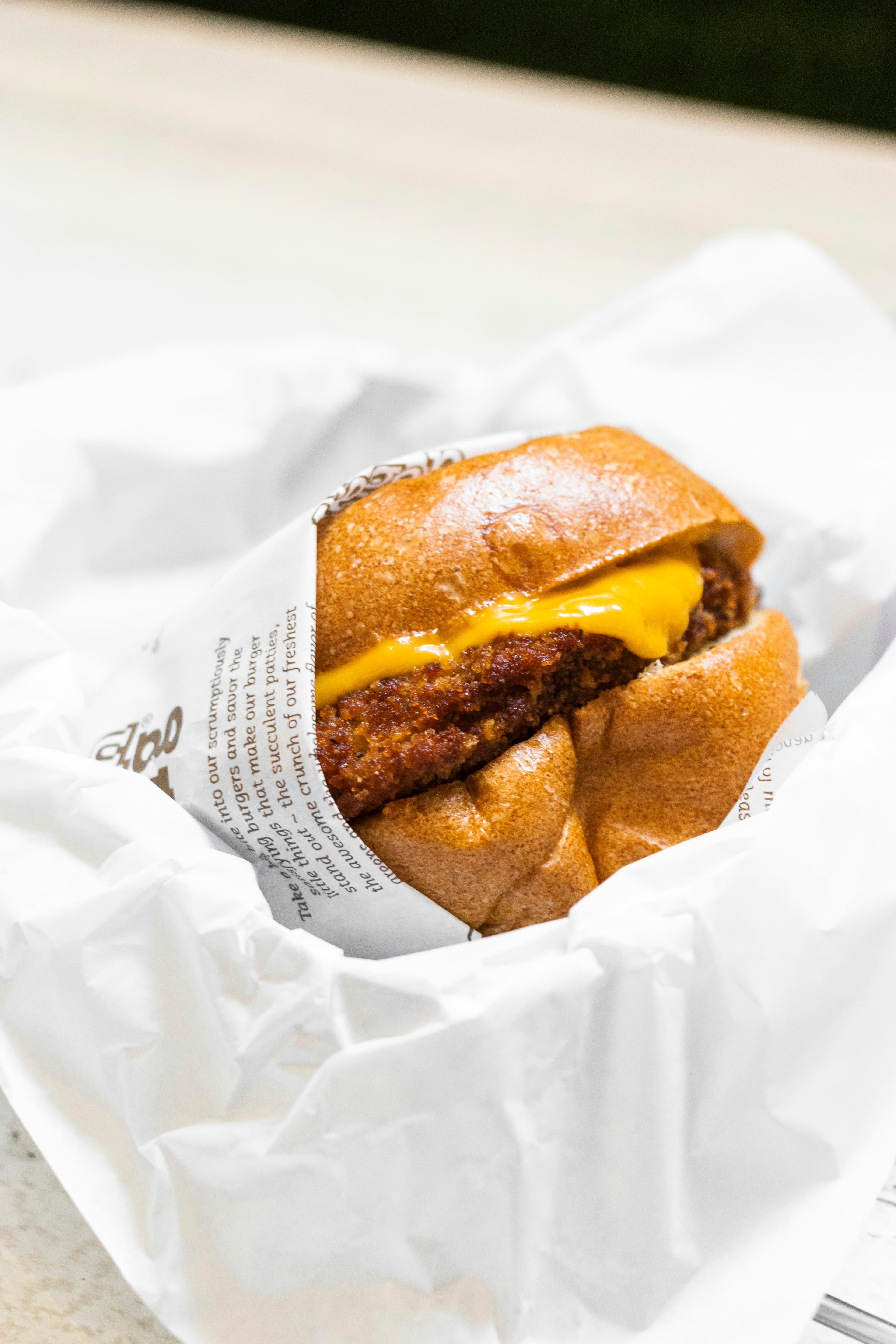Cheese burger with double melted cheese slices over crispy golden patty